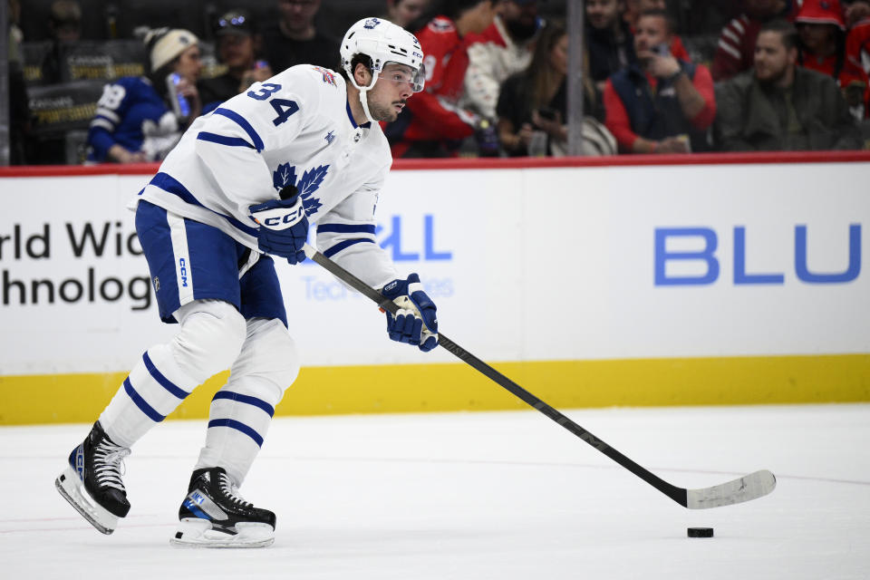 Toronto Maple Leafs center Auston Matthews skates with the puck during the first period of the team's NHL hockey game against the Washington Capitals, Tuesday, Oct. 24, 2023, in Washington. (AP Photo/Nick Wass)