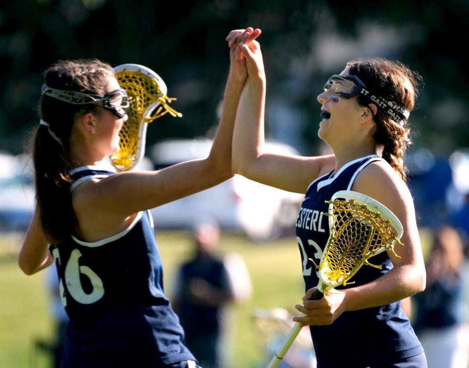 Westerly players congratulate each other during a game last May.