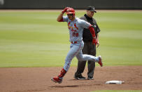 CORRECTS THE DAY AND DATE TO SUNDAY, JUNE 20, NOT SATURDAY, JUNE 19 - St. Louis Cardinals' Nolan Arenado rounds second base after hitting a two-run home run in the first inning of the first baseball game of a double header Sunday, June 20, 2021, in Atlanta. (AP Photo/Ben Margot)