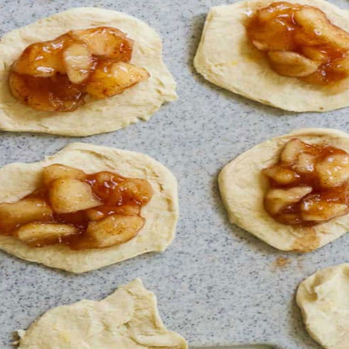 Dough topped with apple pie filling.