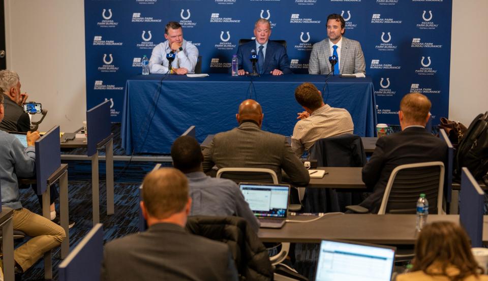 Media members talk with Chris Ballard, general manager, Jim Irsay, owner, and interim head coach Jeff Saturday on Nov. 7 during a news conference at the Colts headquarters in Indianapolis.