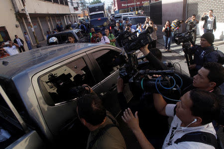 Cameramen and photographers surround a truck believed to be transporting former first lady Rosa Elena Bonilla while arriving at the facilities of the Technical Criminal Investigation Agency (ATIC) in Tegucigalpa, Honduras February 28, 2018. REUTERS/Jorge Cabrera