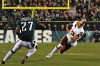 FILE PHOTO: Dec 3, 2018; Philadelphia, PA, USA; Washington Redskins quarterback Colt McCoy (12) carries the ball as Philadelphia Eagles strong safety Malcolm Jenkins (27) defends in the second quarter at Lincoln Financial Field. Mandatory Credit: James Lang-USA TODAY Sports