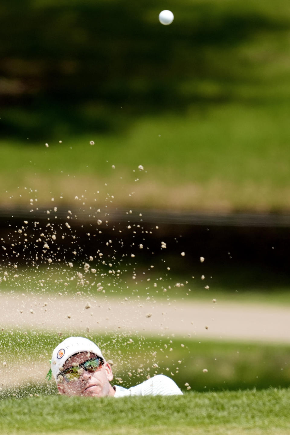 Ben Kohles hits his ball out of the sand on the first hole during the third round of the Byron Nelson golf tournament in McKinney, Texas, Saturday, May 4, 2024. (AP Photo/LM Otero)