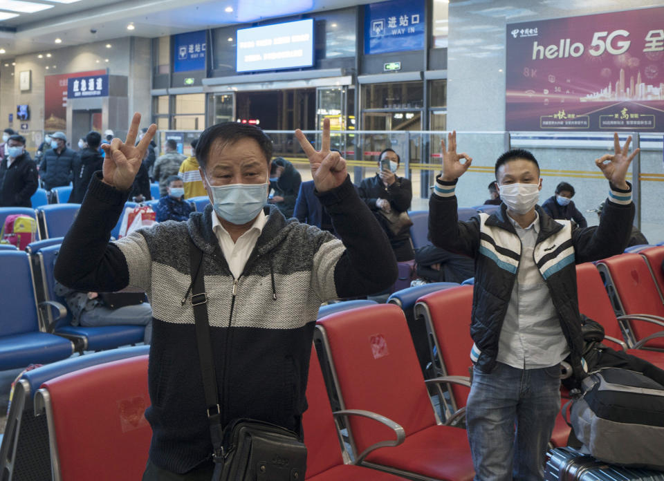 WUHAN, April 7, 2020 .Passengers cheer up for Wuhan while waiting to take train K81 at Wuchang Railway Station in Wuhan, central China's Hubei Province, late April 7, 2020. The train K81, which started from Xi'an of northwest China's Shaanxi Province and is heading for Guangzhou in south China's Guangdong Province, made a stop to pick up 442 passengers at Wuchang Railway Station in Wuhan early Wednesday, the first one since the city lifted its outbound travel restrictions. (Photo by Fei Maohua/Xinhua via Getty) (Xinhua/Fei Maohua via Getty Images)