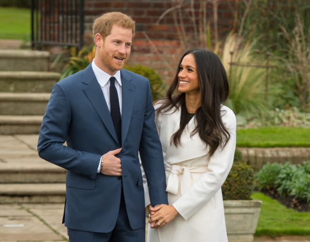 Prince Harry and Meghan Markle in the Sunken Garden. (Dominic Lipinski/PA)