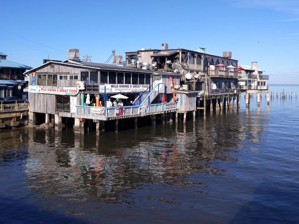 Stilted buildings over the water.
