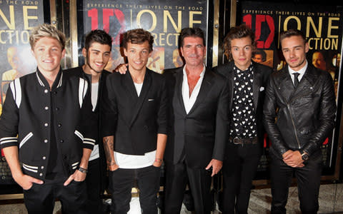 L to R: Niall Horan, Zayn Malik, Louis Tomlinson, Simon Cowell, Harry Styles and Liam Payne attend the World Premiere of 'One Direction: This Is Us 3D'  - Credit: Getty Images