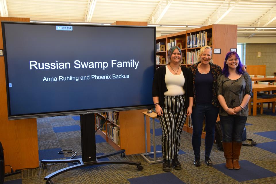 (From left) Phoenix Backus, Kerri Finlayson and Anna Ruhling pose for a photo following a research presentation on April 26.