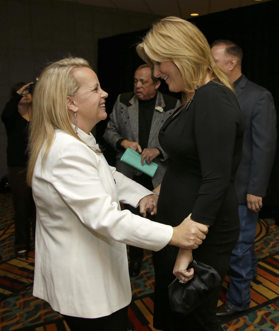Mary Chapin Carpenter, left, greets Trisha Yearwood before the Nashville Songwriters Hall of Fame inductions on Sunday, Oct. 7, 2012, in Nashville, Tenn. Carpenter is one of the inductees. (AP Photo/Mark Humphrey)