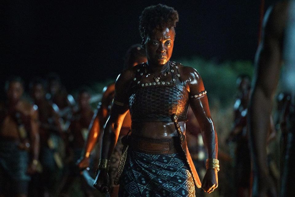 Viola Davis standing with a sword by her side