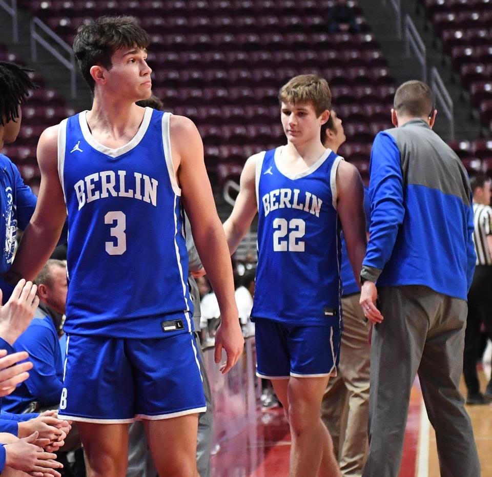 Berlin Brothersvalley seniors Craig Jarvis (3) and Pace Prosser (22) come to the bench in the waning moments of the PIAA Class 1A boys' basketball championship game against Imani Christian, March 21, at the Giant Center in Hershey.
