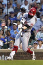 Cincinnati Reds' Jesse Winker swings on an RBI double off Chicago Cubs starting pitcher Zach Davies during the third inning of a baseball game Wednesday, July 28, 2021, in Chicago. (AP Photo/Charles Rex Arbogast)