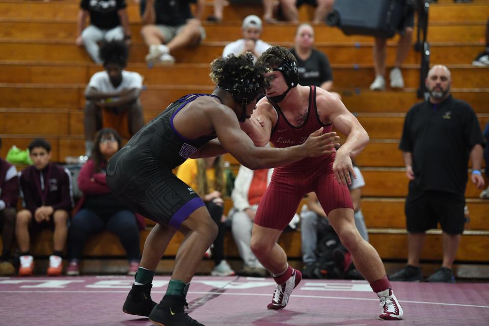 Lake Gibson's Jace Brownlow, right, competes in a match vs. Winter Springs' Elijah Penton. Brownlow took second place after falling in a sudden victory, 3-1.