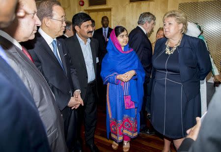 U.N. Secretary-General Ban Ki-moon (4th R), Nobel Peace Prize winner Malala Yousafzai (2nd R) and Norway's Prime Minister Erna Solberg (R) participate in the Oslo Summit on Education for Development at Oslo Plaza in Oslo, Norway July, 7, 2015. REUTERS/Vegard Wivestad Grott/NTB Scanpix