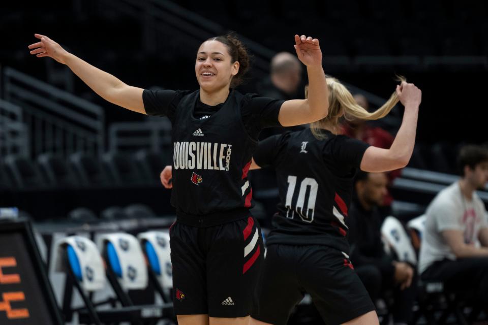 Louisville's Mykasa Robinson and Hailey Van Lith during practice at Seattle's Climate Pledge Arena.