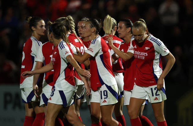 Arsenal players celebrate after beating Rangers in their Women's Champions League qualifying contest