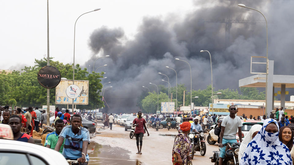 Smoke rises after coup supporters set fire to the headquarters of President Mohamed Bazoum's party, the Party for Democracy and Socialism in Niger in Niamey, Niger on July 27, 2023. (Balima Boureima / Anadolu Agency via Getty Images)