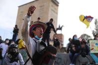 Demonstrators take part in a protest, in Bogota