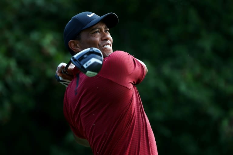 Tiger Woods of the United States plays his shot from the 18th tee