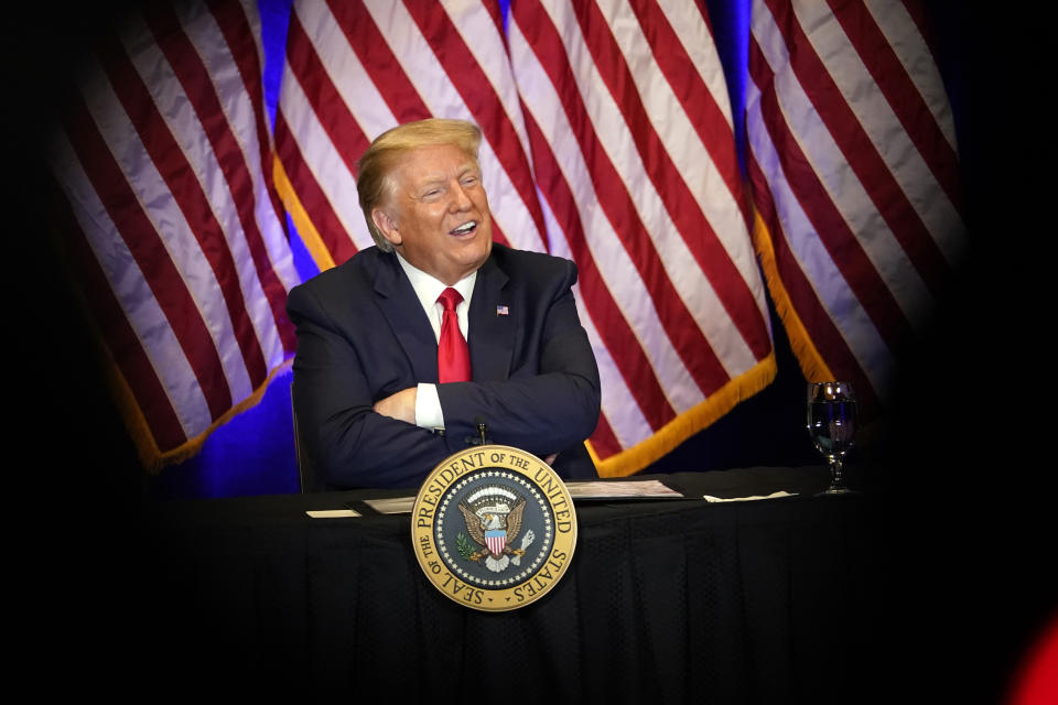 President Donald Trump smiles during a Latinos for Trump Coalition roundtable at Treasure Island Hotel & Casino, Sunday, Sept. 13, 2020, in Las Vegas. (AP Photo/Andrew Harnik)