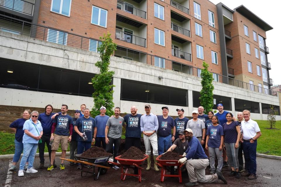 Parks Director Jason Barron, third from left, and Parks Board President Jim Goetz, far right, join Cincinnati Mayor Aftab Pureval, center, in May at the Mayor's Corporate Challenge. Cincinnati employers participate in the annual event to volunteer in parks.