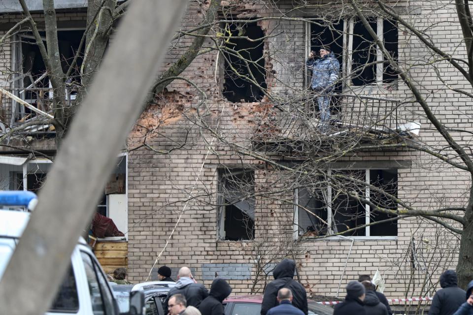 An investigator works at the side of the damaged apartment's building after a reported drone attack in St. Petersburg, Russia, Saturday, March 2, 2024. Russian authorities said Saturday morning that an "emergency" damaged an apartment building in St. Petersburg. State news agency Tass said that the damage was caused by an "explosion," while local news and social media said that a drone had hit the building. There were no casualties, St. Petersburg Gov. Alexander Beglov wrote on Telegram. (AP Photo)