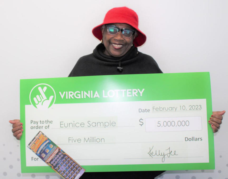 Eunice Sample poses with her lottery winning cheque. 