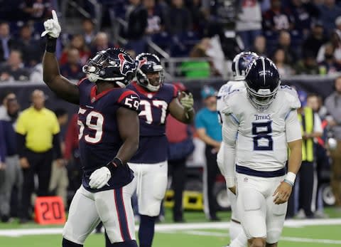 Houston Texans outside linebacker Whitney Mercilus (59) celebrates after he sacked Tennessee Titans quarterback Marcus Mariota (8) during the second half - Credit: AP Photo/David J. Phillip