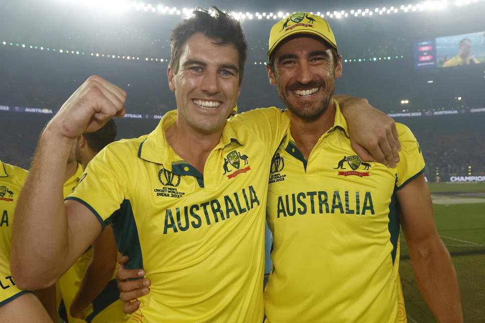 Pat Cummins and Mitchell Starc celebrate.