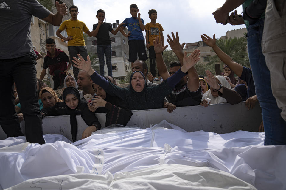 People mourn those killed in an Israeli airstrike in Gaza City on Monday. (Fatima Shbair/AP)