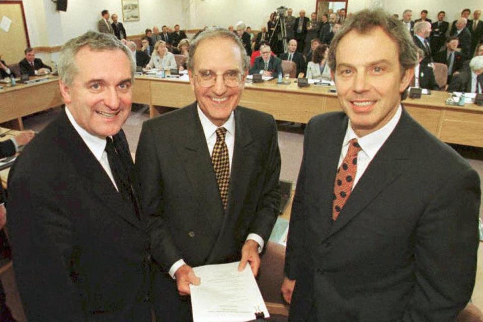 Tony Blair, US Senator George Mitchell (centre) and Irish PM Bertie Ahern smiling after they signed a historic agreement for peace in Northern Ireland in 1998, ending a 30-year warAFP/Getty