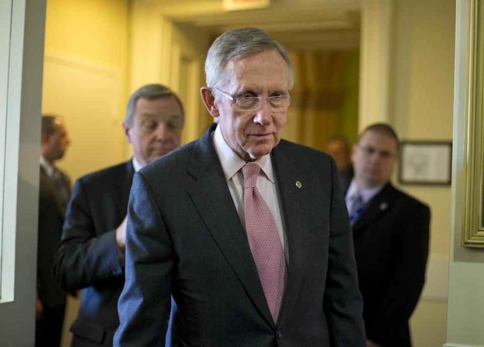 Senate Majority Leader Harry Reid of Nev., center, followed by Senate Majority Whip Richard Durbin of Ill., left, arrives for a news conference on Capitol Hill in Washington, Thursday, Nov. 29, 2012, following a meeting with Treasury Secretary Timothy Geithner on the fiscal cliff negotiations. (AP Photo/J. Scott Applewhite)