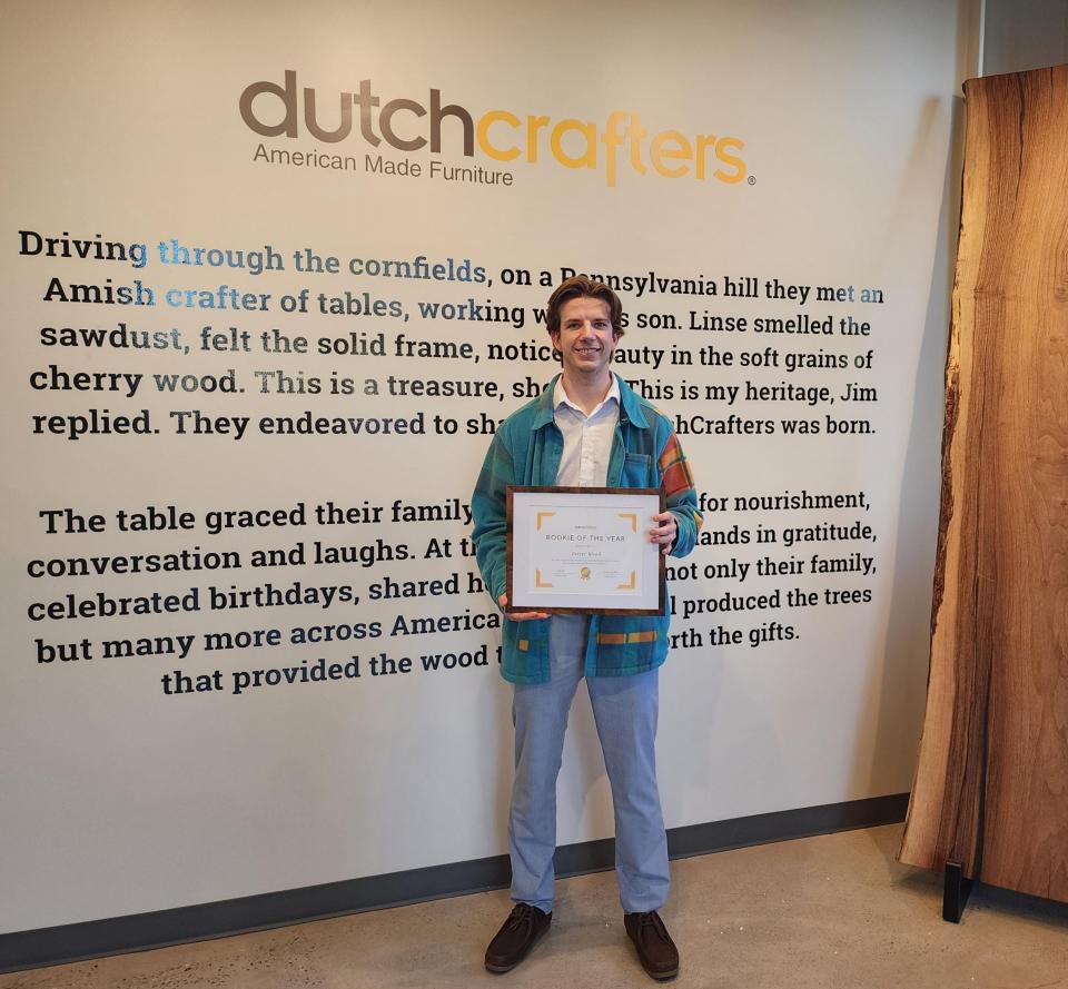 Carter Wood, with the Rookie of the Year Award from DutchCrafters.