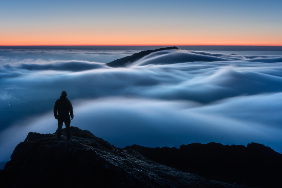 Overall winner "Above My Expectations", taken by Gareth Mon Jones, shows a blanket of cloud draped across Y Lliwedd, one of the flanks of Snowdon in North Wales (Picture: PA)