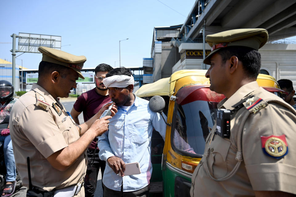 Indian traffic police conduct drinking and driving checks during the Holi holiday, March 25, 2024, in Noida, India. / Credit: Sunil Ghosh/Hindustan Times/Getty