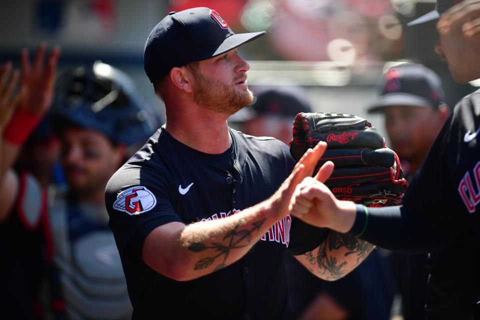 Cleveland Guardians pitcher Ben Lively (39) is greeted after the seventh inning against the Los Angeles Angels on May 26 in Anaheim, California.