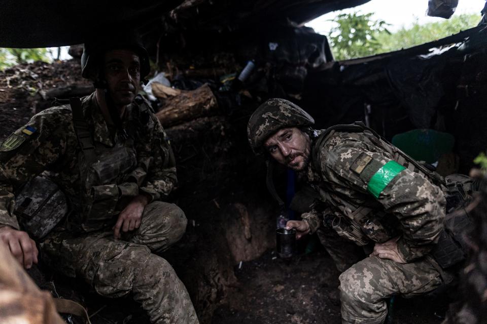 Ukrainian infantrymen sit in a trench on the front line contact line of the frontline as Russia-Ukraine war continues, in Lugansk Oblast, Ukraine on July 29, 2023.