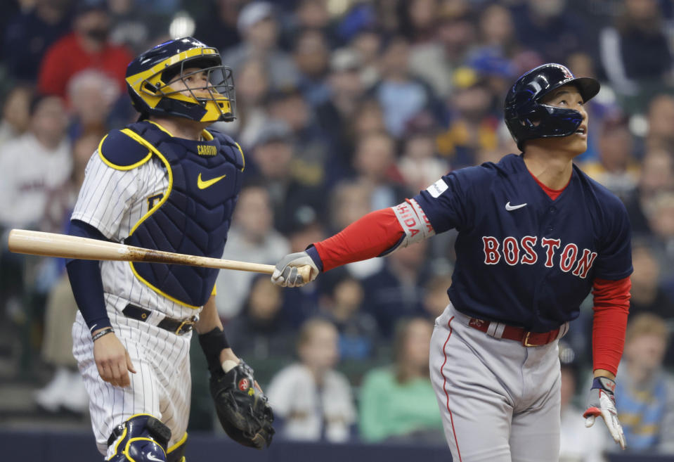 Boston Red Sox left fielder Masataka Yoshida watches his RBI sacrifice fly against the Milwaukee Brewers during the first inning of a baseball game, Sunday, April 23, 2023, in Milwaukee. (AP Photo/Jeffrey Phelps)