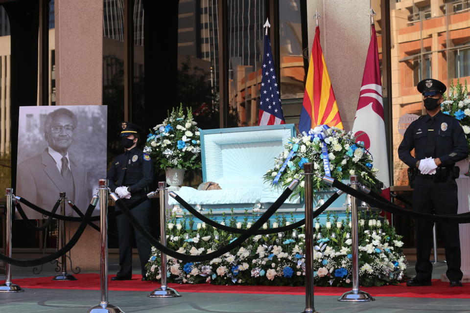 Calvin C. Goode is laid at state in front of Calvin C. Goode Municipal Building in Phoenix, Ariz on Saturday, Jan. 9, 2021. Family members and members of the community attended the public, socially distanced viewing for Goode who died on Wednesday, Dec. 23, 2020. He was 93. (AP Photo/Cheyanne Mumphrey)