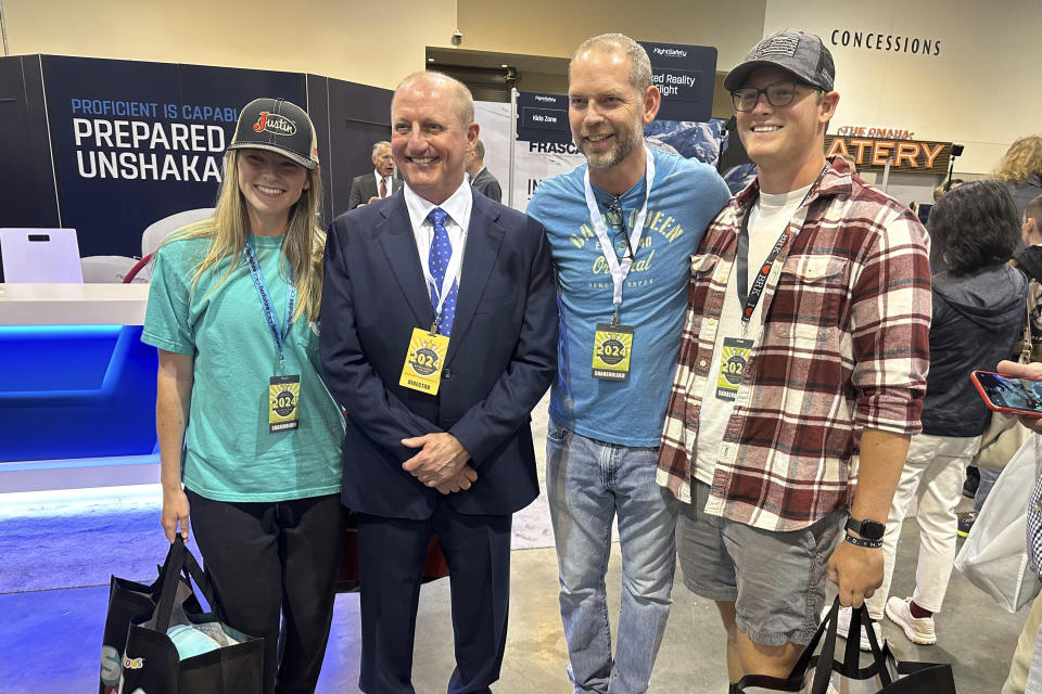 Berkshire Hathaway Vice Chairman Greg Abel poses with shareholders Friday, May 3, 2024, in Omaha, Neb. Abel is set to be the next CEO after Warren Buffett is gone. (AP Photo/Josh Funk)