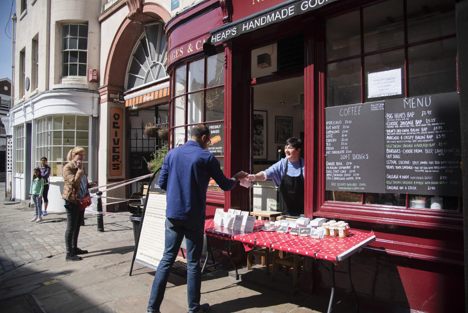 A cafe in London serves take away, April 15. The hospitality and retail industries have been hit particularly hard by the pandemic. (Photo: Claire Doherty via Getty Images)