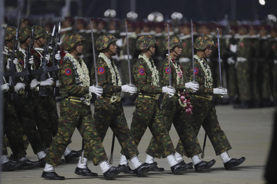 Myanmar military officers march during a parade to commemorate Myanmar's 79th Armed Forces Day, in Naypyitaw, Myanmar, Wednesday, March 27, 2024. (AP Photo/Aung Shine Oo)