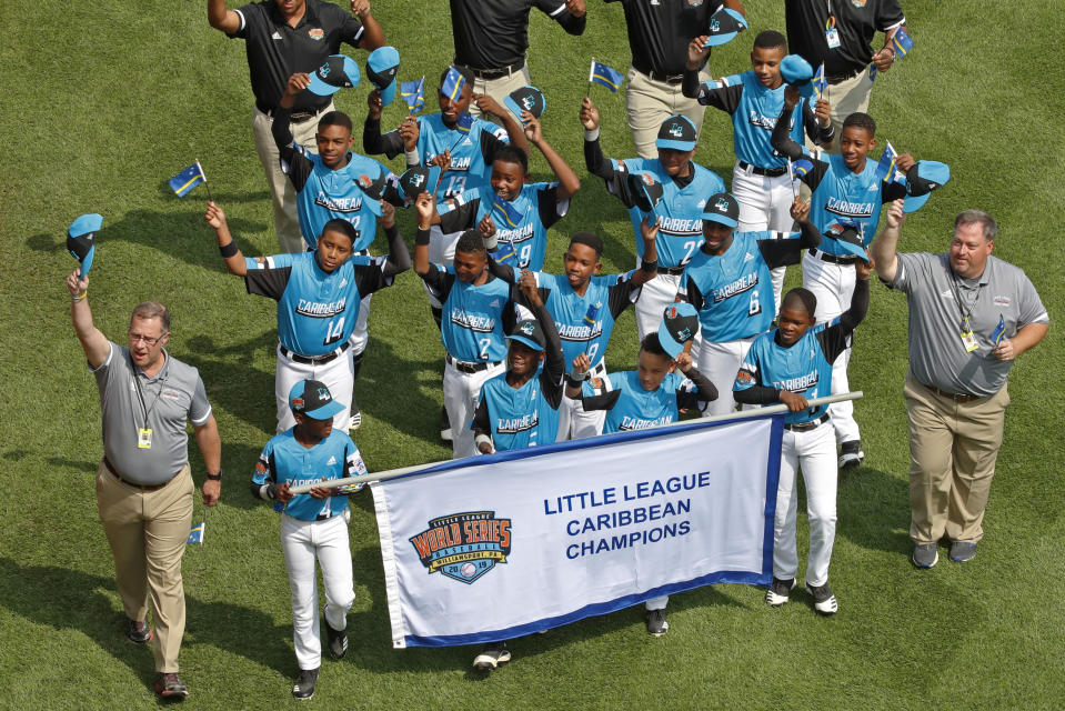 The Caribbean Region Champion Little League team from Willemstad, Curacao participates in the opening ceremony of the 2019 Little League World Series baseball tournament in South Williamsport, Pa., Thursday, Aug. 15, 2019. (AP Photo/Gene J. Puskar)