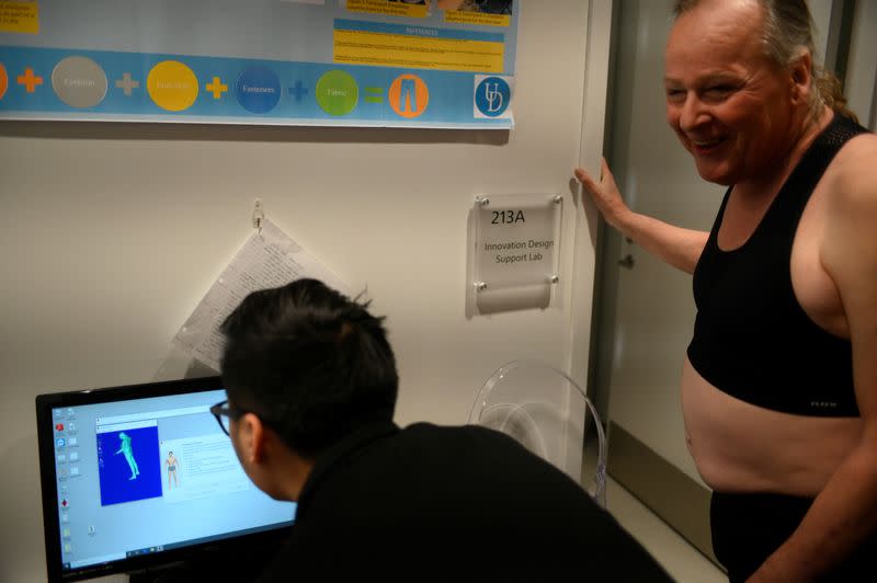 Willa Patsy Sharpe reacts as a three-dimensional result appears on the screen after graduate student Haobo Zhang performed a full body scan at the Innovation Health and Design Lab at University of Delaware STAR Campus in Newark