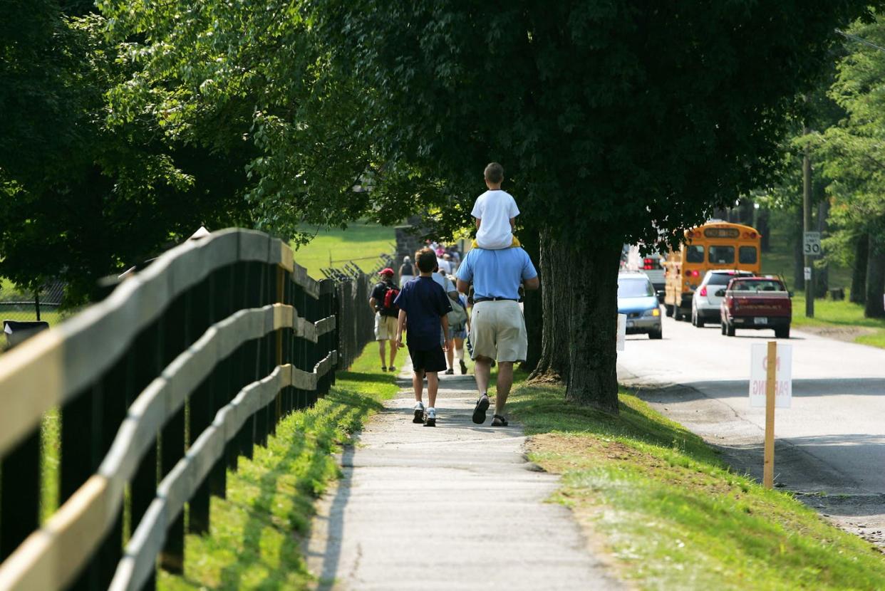 <span class="caption">Small inland towns can offer a haven for people escaping coastal climate change.</span> <span class="attribution"><a class="link " href="https://www.gettyimages.com/detail/news-photo/fans-walk-down-the-street-to-the-baseball-hall-of-fame-news-photo/53310479" rel="nofollow noopener" target="_blank" data-ylk="slk:Ezra Shaw/Getty Images;elm:context_link;itc:0;sec:content-canvas">Ezra Shaw/Getty Images</a></span>