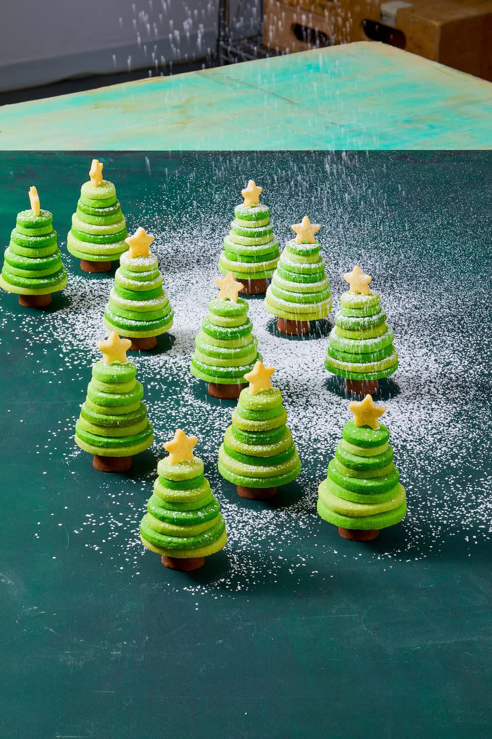 <p>"Glue" a stack of sugar cookies together with royal icing to create the perfect edible pine.</p><p>Get the <a href="https://www.goodhousekeeping.com/food-recipes/dessert/a38014289/cookie-trees-recipe/" rel="nofollow noopener" target="_blank" data-ylk="slk:Sugar Cookie Trees recipe;elm:context_link;itc:0;sec:content-canvas" class="link "><strong>Sugar Cookie Trees recipe</strong></a>.</p>