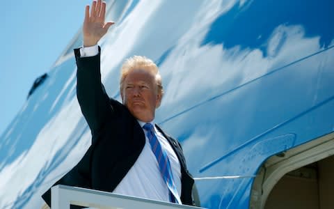 President Trump boards a flight for Singapore to meet Kim Jong-un - Credit: Evan Vucci/AP