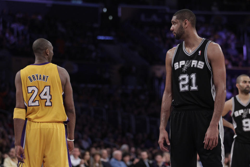 Los Angeles Lakers shooting guard Kobe Bryant and San Antonio Spurs center Tim Duncan during the first half of an NBA basketball game in Los Angeles, Thursday, Feb. 3, 2011. (AP Photo/Jae C. Hong)