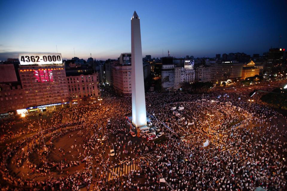 Protesters demonstrate during a march against Argentina's President Cristina Fernandez in Buenos Aires, Argentina, Thursday, Nov. 8, 2012. Angered by rising inflation, violent crime and high-profile corruption, and afraid Fernandez will try to hold onto power indefinitely by ending constitutional term limits, the protesters banged pots and marched on the iconic obelisk in Argentina's capital. Protests also were held in plazas nationwide and outside Argentine embassies and consulates around the world. (AP Photo/Natacha Pisarenko)